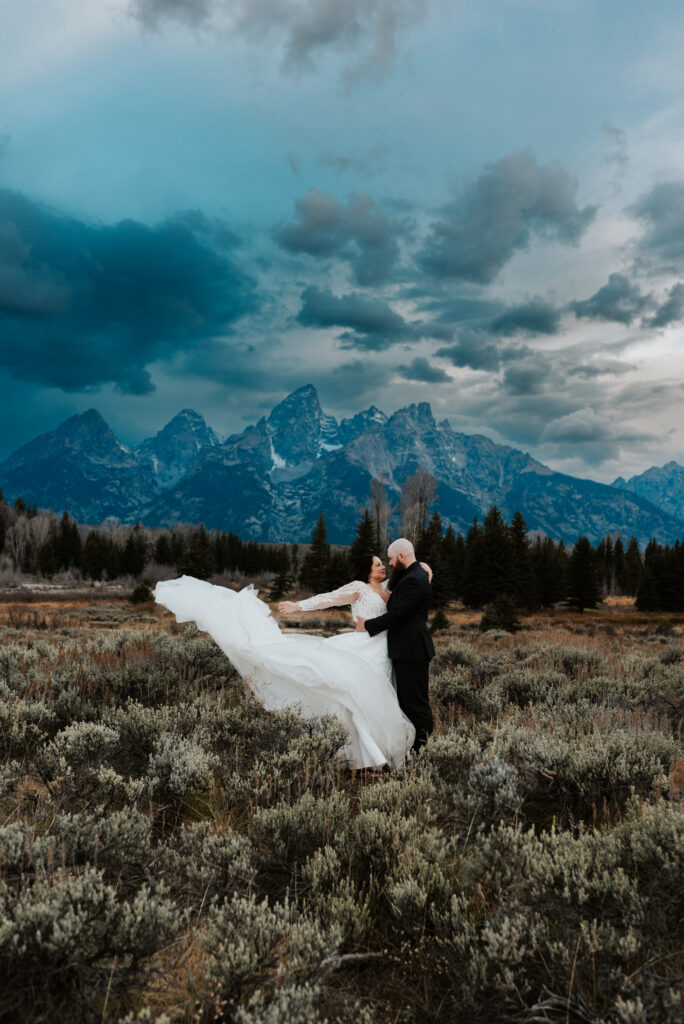 Schwabacher Landing at sunrise with reflection of the Teton Mountains, peaceful river, and golden light — Grand Teton elopement location.