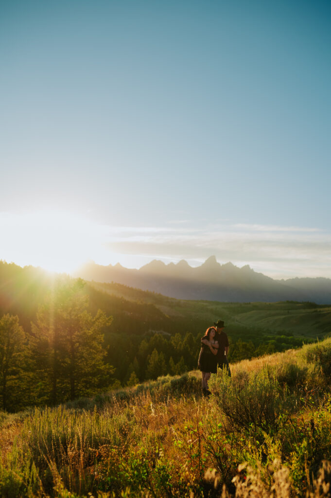 The Wedding Tree overlooking the Teton Range with two intertwined trees framing the mountains — intimate Jackson Hole elopement location.