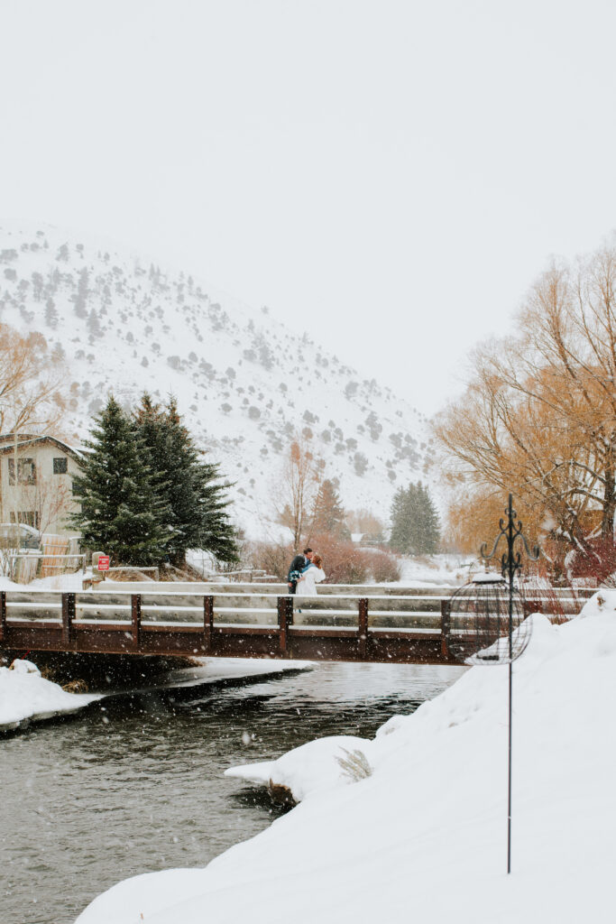 Bride and groom saying vows during peaceful winter Wyoming elopement