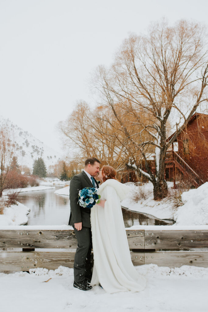 Bride and groom in snowy downtown Jackson, Wyoming