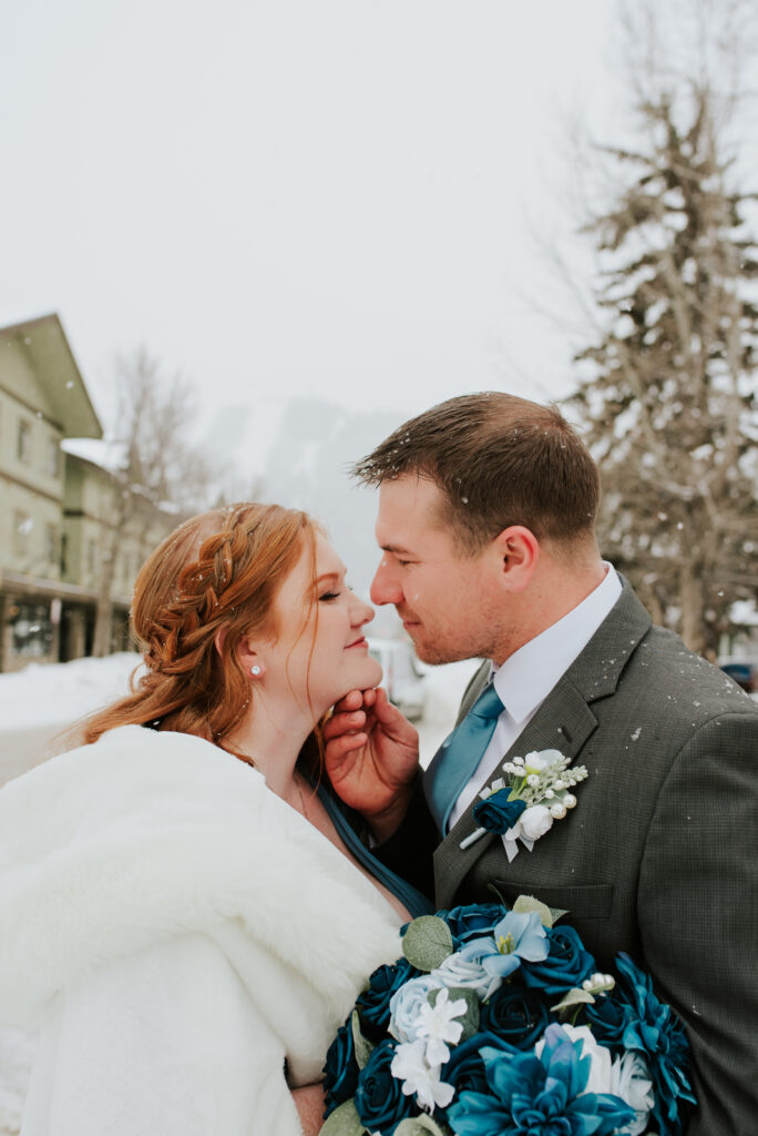 Romantic winter wedding photos at Jackson Town Square antler arches