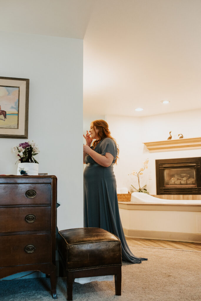 Bride getting ready at Inn on the Creek in Jackson Hole during a winter elopement