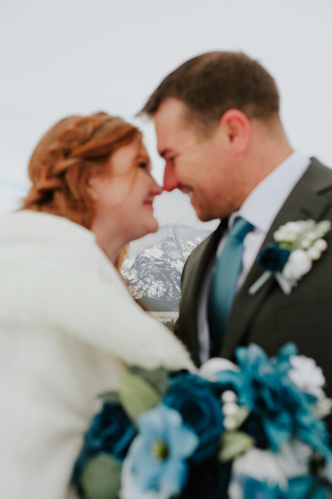 Intimate winter elopement in Grand Teton National Park with dramatic snowy mountain backdrop