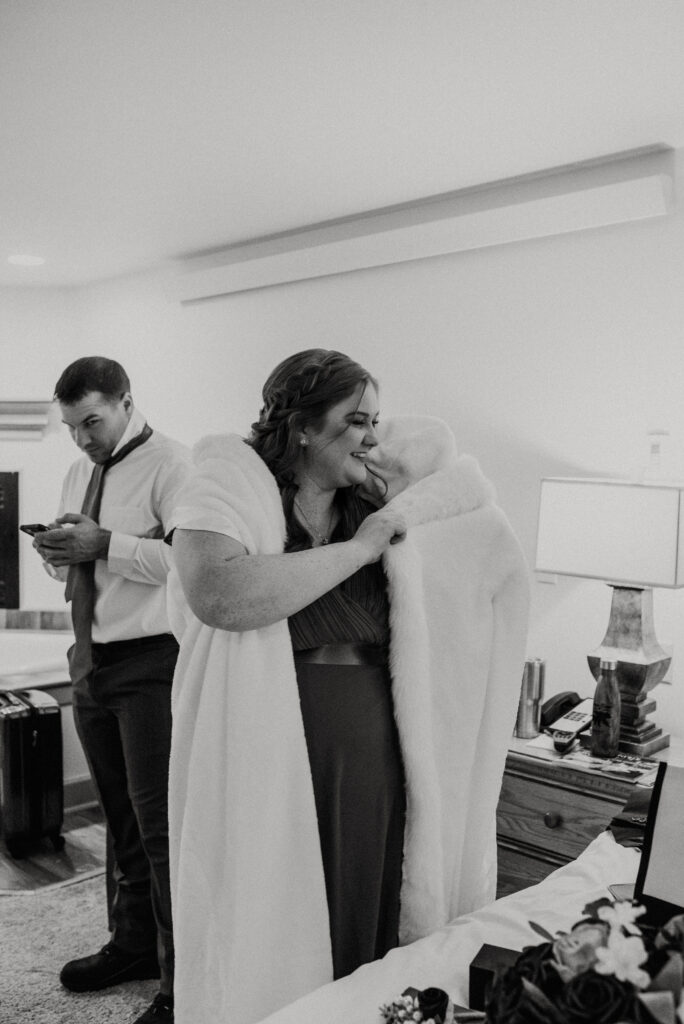 Bride getting ready at Inn on the Creek in Jackson Hole during a winter elopement