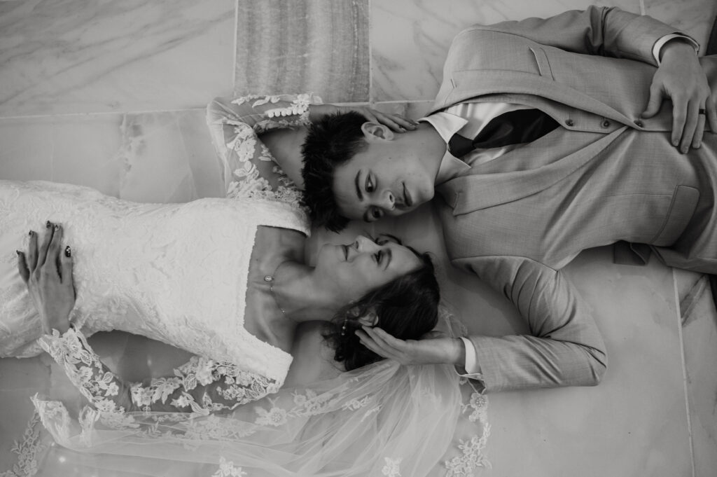 Bride and groom laying down inside Castle Nottingham Pocatello Idaho