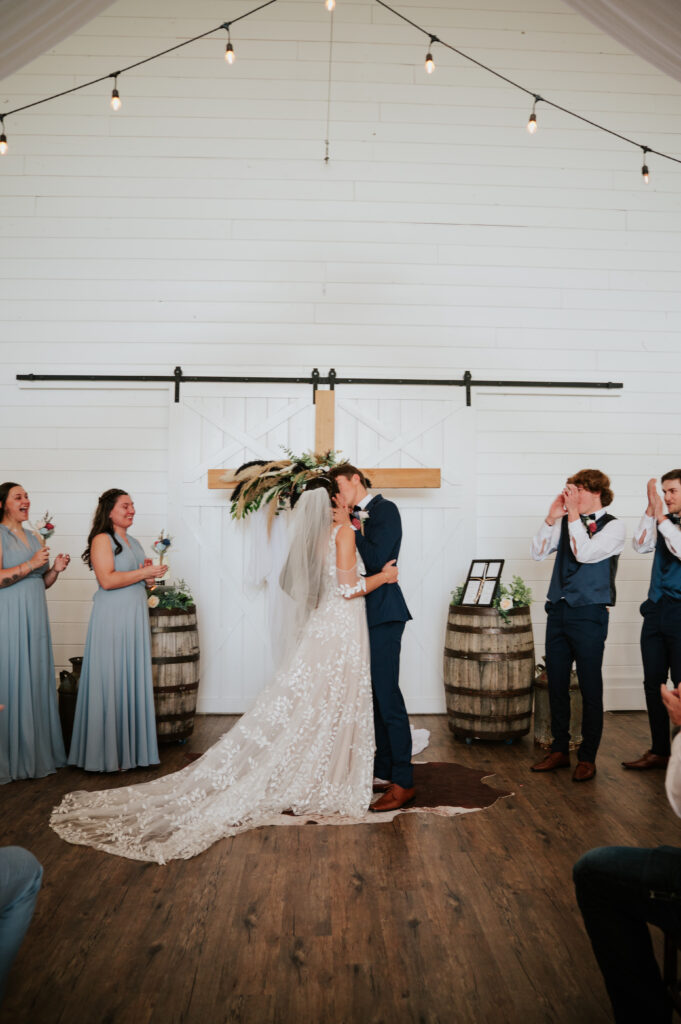 Romantic indoor ceremony at The Barn on 1st wedding venue in Idaho Falls, Idaho