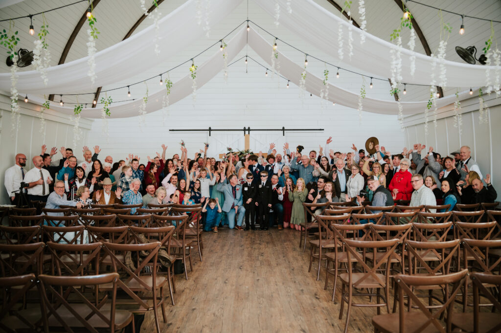 Romantic indoor ceremony at The Barn on 1st wedding venue in Idaho Falls, Idaho
