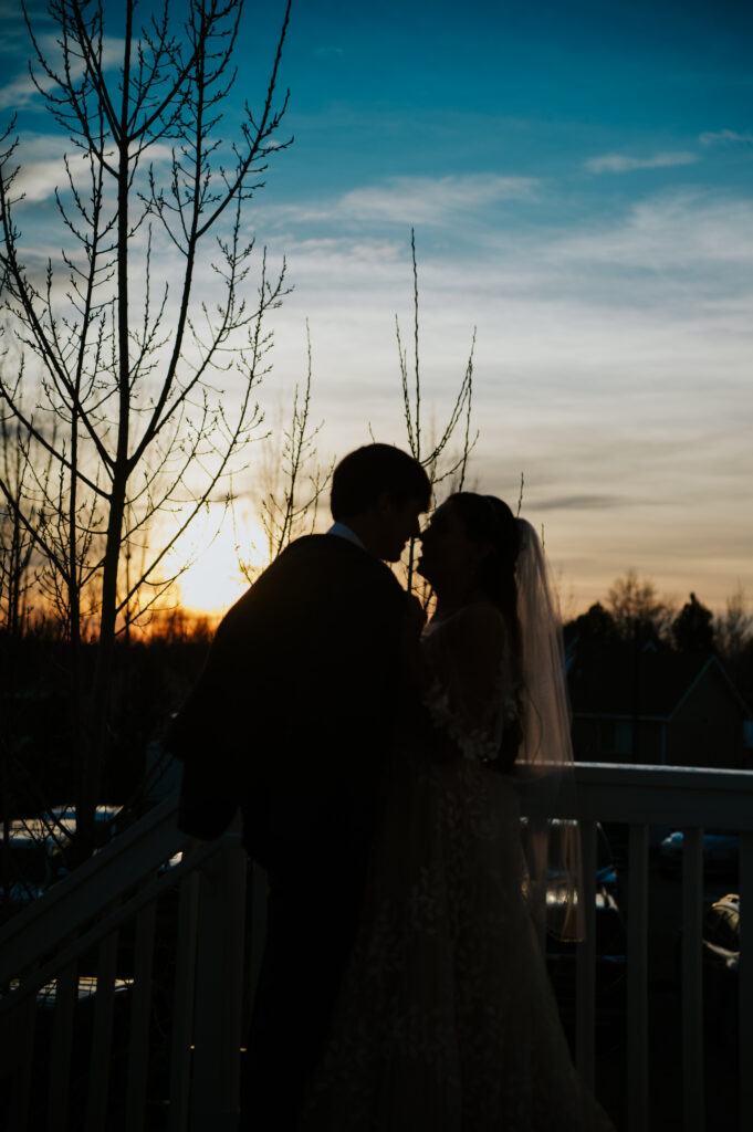 Golden hour portraits at a Barn on 1st wedding in Idaho Falls with romantic sunset lighting