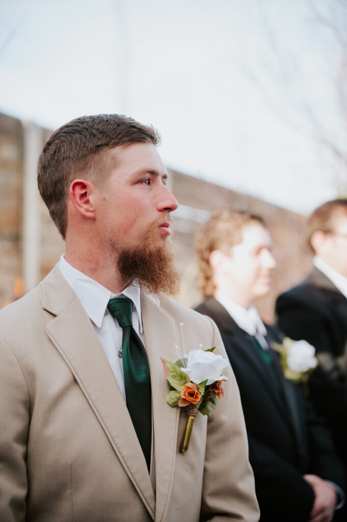 Grooms Reaction to Bride walking down the aisle at Millhouse Venue Rigby wedding ceremony