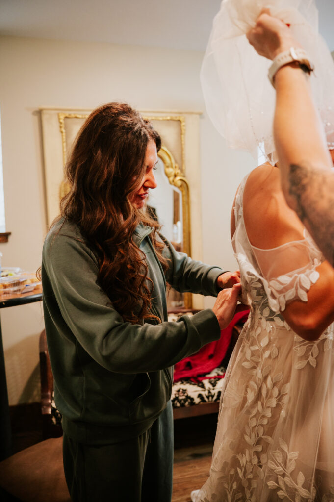 Emotional getting ready moments before a Barn on 1st wedding in Idaho Falls captured in natural light