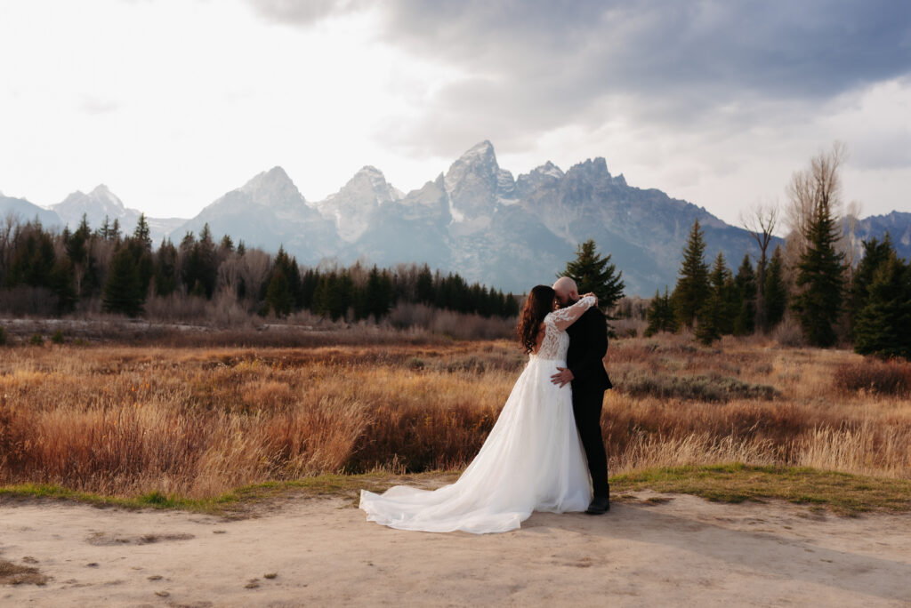 Idaho Falls bride wearing Margene’s Bridal gown in mountains