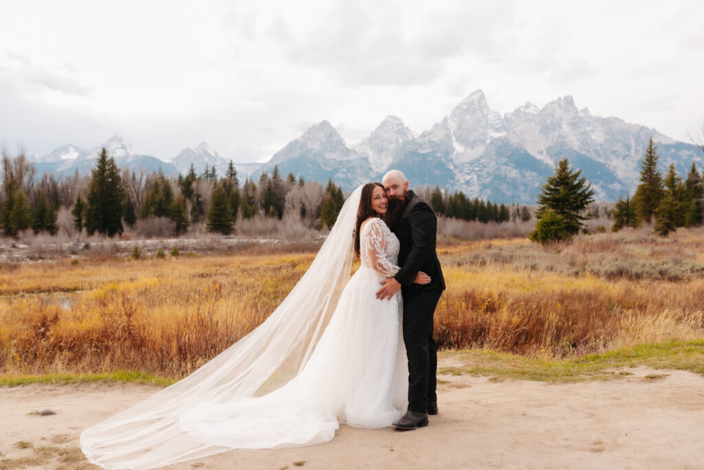flowy wedding dress wind mountain bridal session Tetons