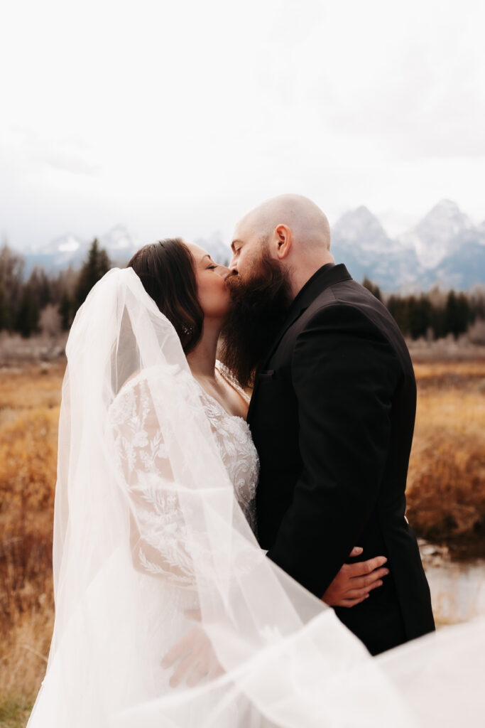 flowy wedding dress wind mountain bridal session Tetons
