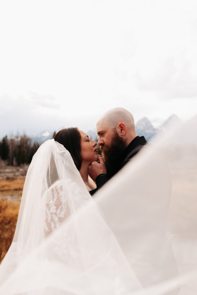 Idaho Falls bride wearing Margene’s Bridal gown in mountains