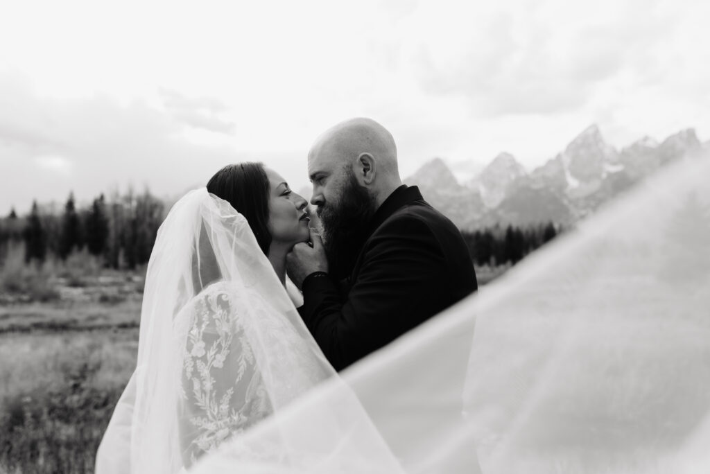 Idaho Falls bride wearing Margene’s Bridal gown in mountains