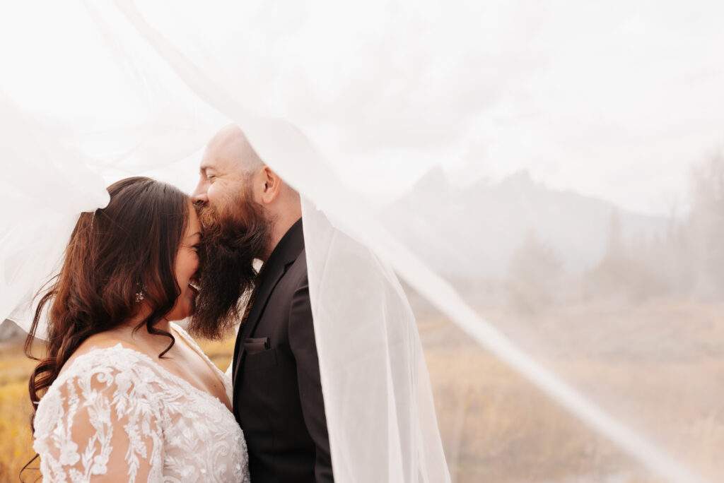 flowy wedding dress wind mountain bridal session Tetons